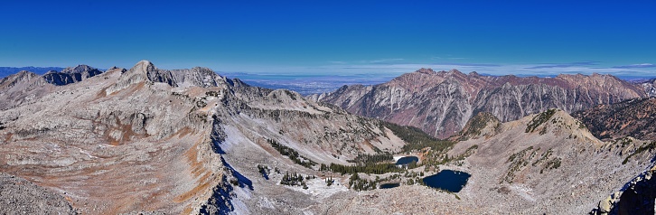 View of Pfeifferhorn peak and Lone Peak Wilderness mountain landscape from White Baldy and Pfeifferhorn trail, towards Salt Lake Valley, Wasatch Rocky mountain range, Utah, United States.