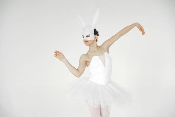 istock Ballerina posing in front of white background 1286423214
