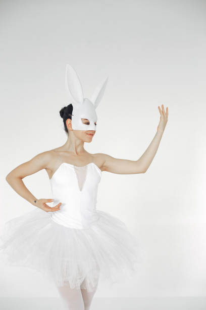 istock Ballerina posing in front of white background 1286423227
