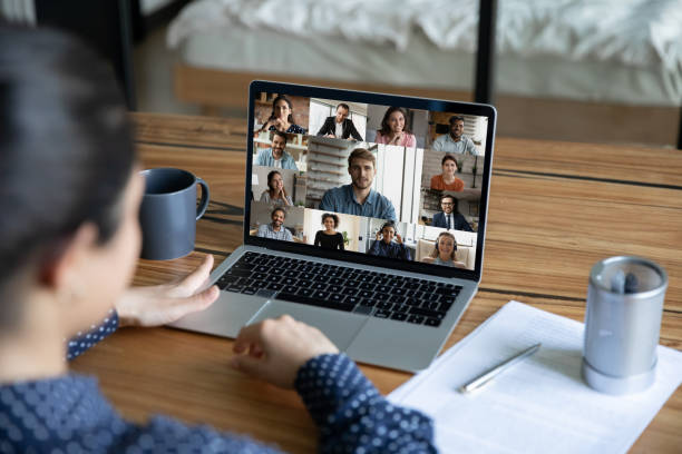 istock Female employee have webcam team online meeting 1286423344