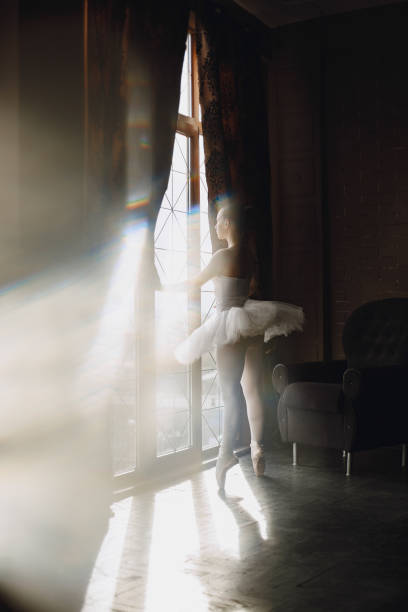istock Ballerina posing in front of white background 1286423353