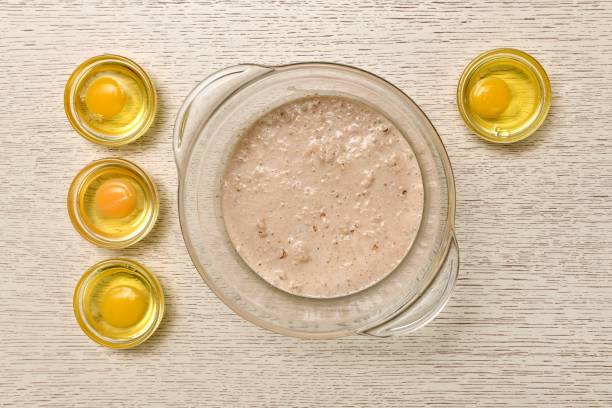 istock Cooked eggs in cups. And a bowl of yeast diluted in milk. 1286426211
