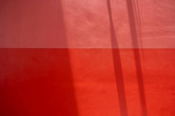 istock Abstract Background Grunge, Weathered Painted Red Concrete Wall With Sunlight And Shadow 1286432428