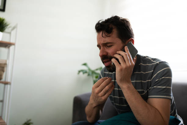 istock Hispanic man talking about his feelings on the phone 1286432719