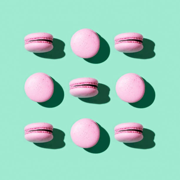 istock Regular creative pattern of colorful french cookies macarons. 1286434534