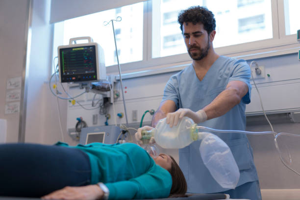 istock Male nurse ventilating patient at emergency room 1286437181