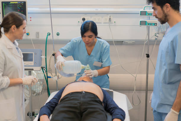 istock Female nurse ventilating patient at emergency room 1286437974