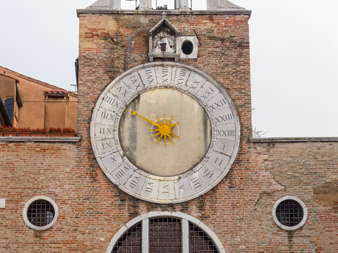 The 15th-century 24-hour clock above the entrance of San Giacomo di Rialto has only one hand - Venice, Veneto, Italy