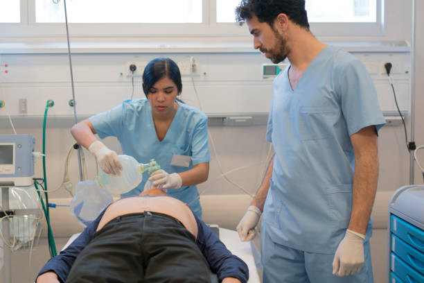 istock Female nurse ventilating patient at emergency room 1286441531