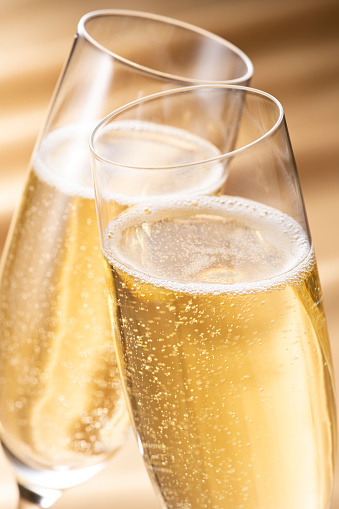 Cheers! Two champagne glasses. Isolated on white background