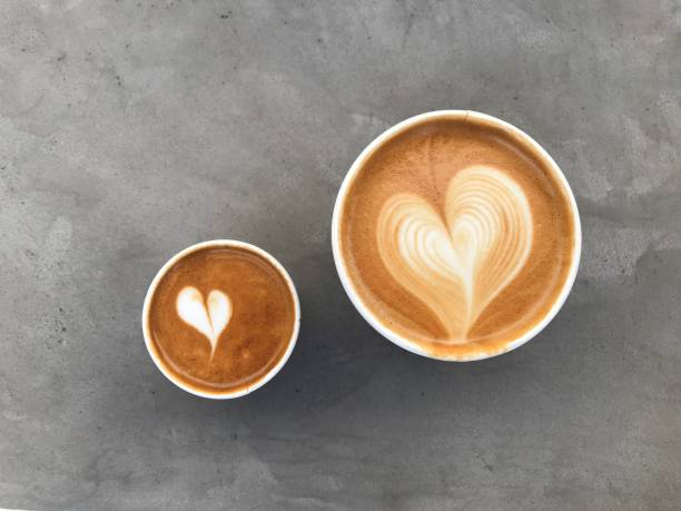 istock heart latte art. hot coffee on the gray background. 1286444653