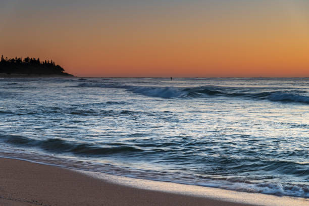 istock Clear skies and small waves, dawn at the beach 1286444761