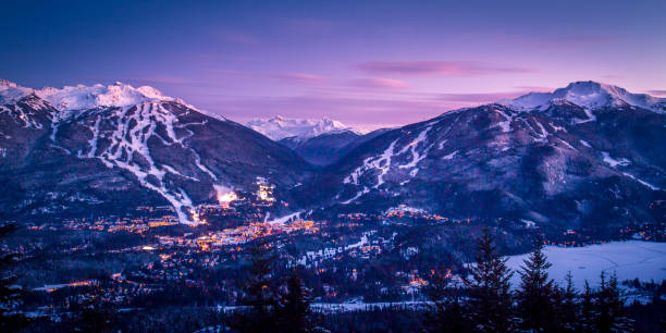 Scenic of Whistler Blackcomb ski resort at dusk. Whistler ski resort in winter. whistler mountain stock pictures, royalty-free photos & images