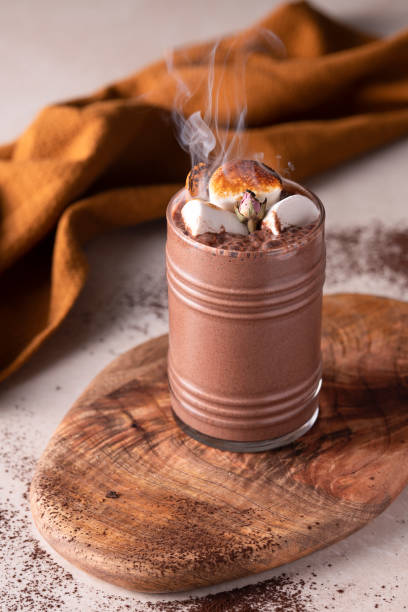A glass of cold chocolate with marshmallow.
