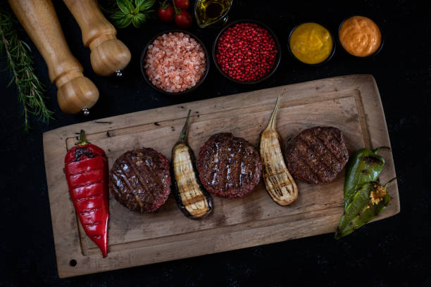 istock Delicious grilled meal in the plate with dark background. 1286449999