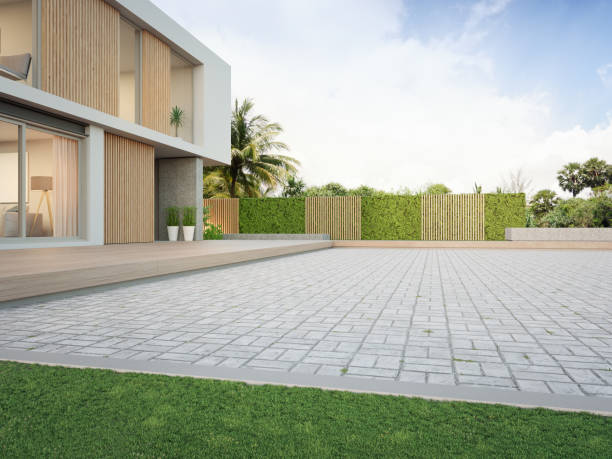 New house with empty cobblestone floor for car park.