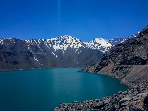 istock snowy mountains and a lake. mountains in chile 1286452100