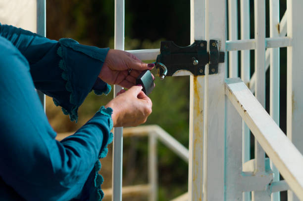 istock woman locking door 1286453254