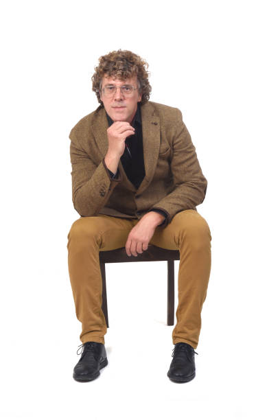 istock man with blazer sitting on chair on white background 1286457376