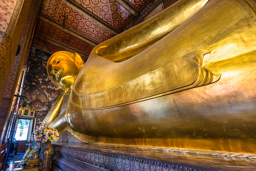 Bangkok, Thailand - December 7, 2019: Reclining Buddha statue in Thailand Buddha Temple Wat Pho, Asian style Buddha Art.