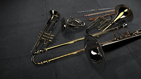 Brass family instruments flute trombone trumpet french horn lying on the floor 3d view from avoe rendering
