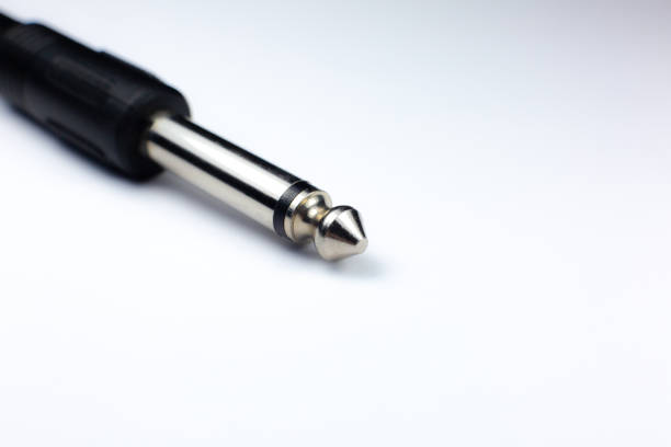 istock Microphone TRS jack, audio connector being plugged into socket on audio device. Close up photo. 1286463879