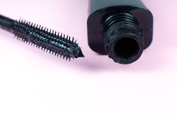 Mascara on eyelashes with brush on pink background."nMake up, cosmetics, beauty. Close up, macro. Mascara on eyelashes with brush on pink background."nMake up, cosmetics, beauty. Close up, macro. mascara wands stock pictures, royalty-free photos & images