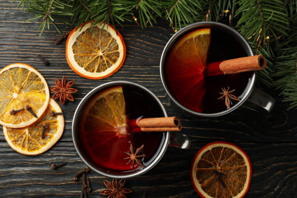 istock Cups with mulled wine, ingredients and pine branches on wooden background 1286464968