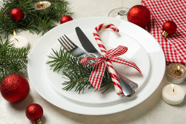 istock Concept of New year table setting with candles on white table 1286466416