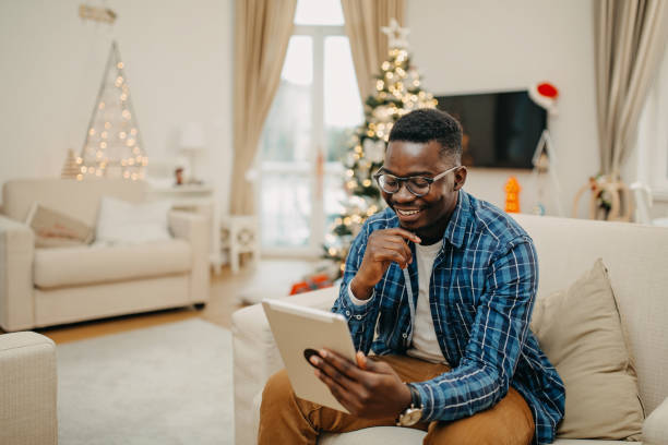 istock Young man working from home during Christmas 1286468747