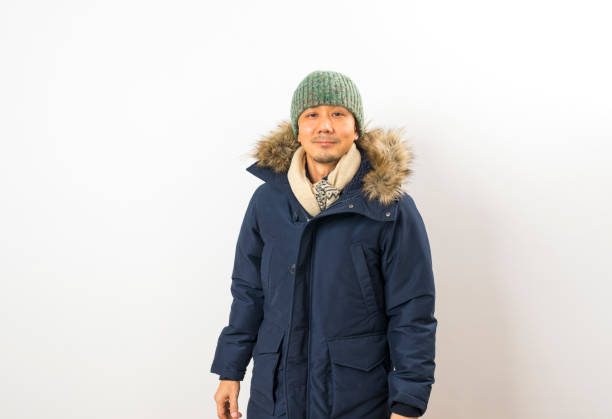 istock Handsome asian man dressed with winter clothing 1286470391