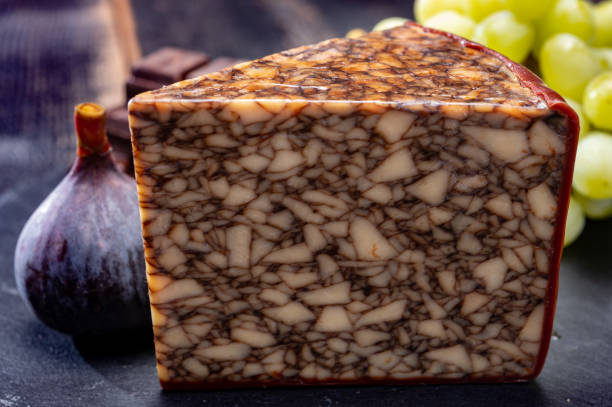 istock Cheese collection, Irish brown waxed marbeled cheddar cheese flavoured with Guinness dark stout beer 1286471538