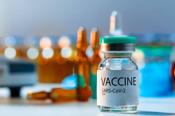 istock Vaccine vials of Sars-cov-2 on table in laboratory . 1286472434