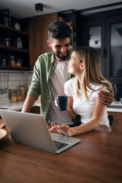istock Happy couple working from home 1286472708