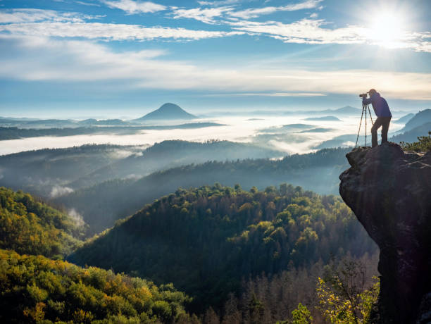 istock Man making photos of mountains during autumn 1286473836
