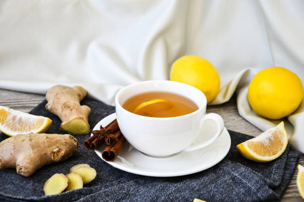 istock Ginger hot immunity boosting Vitamin natural drink With citrus lemon cinnamon anise in a rustic style on wooden background. Chamomile tea 1286473994