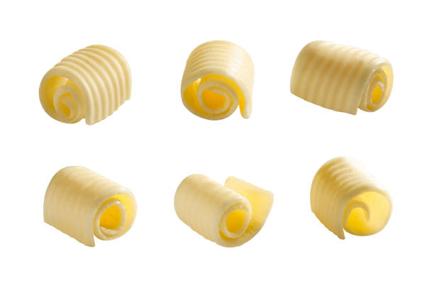Set of different butter rolls or swirl or curls isolated on white background creamy soft butter