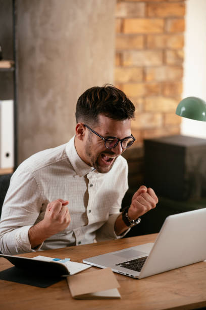 istock Stylish businessman working on a project in the office. 1286475500