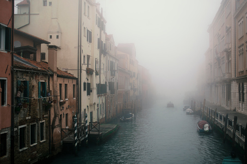 Any canal in Venice hidden by fog.