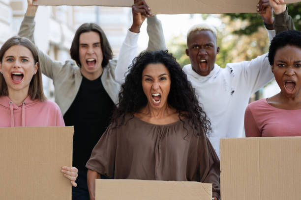 istock Closeup of desperate strikers with empty placards 1286476954