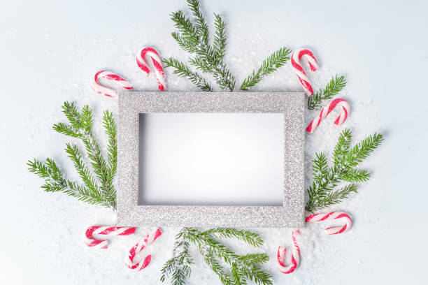 Christmas frame for writing text. New Year's card from a frame and fir branches and sweets. Frame for writing text,copy space. christmas card photos stock pictures, royalty-free photos & images