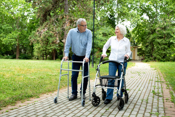 istock Elder man and a elder woman strolling in the park 1286478369