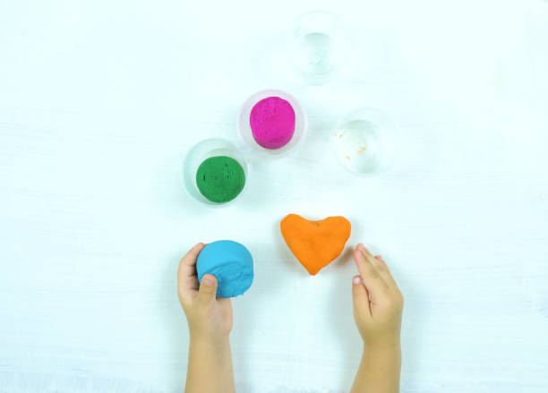 istock colored mass for modeling, decorative dough for children's creativity, baby made a heart 1286478392