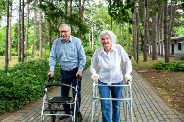 istock Senior couple walking in the park 1286479092