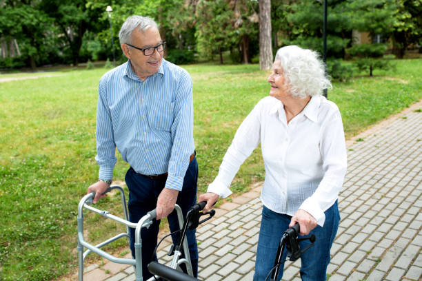 istock Elderly couple chatting and strolling in the park 1286479359