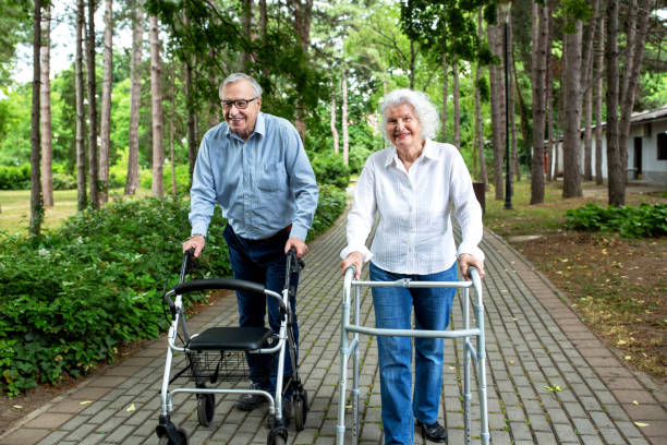 istock Senior couple walking in the park 1286480619