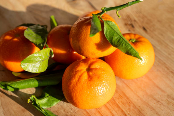 istock Fresh satsumas and leaves 1286481041