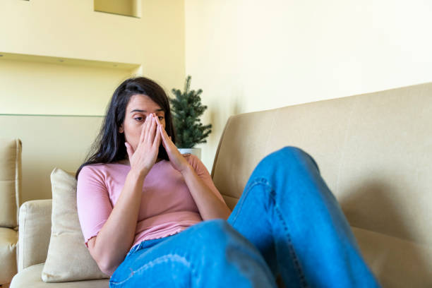 istock Stressed young sick woman having strong terrible headache suffering from chronic migraine or high blood pressure tension massaging temples to relieve head ache pain, tired exhausted girl feeling hurt 1286485812