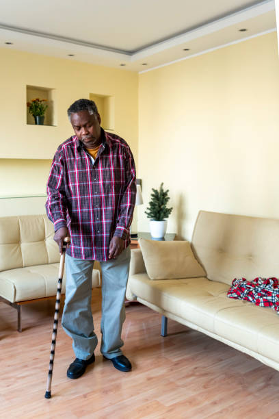 istock Senior Afro-American with Walking Cane at Home 1286485969