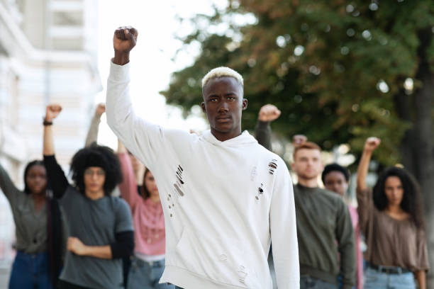 istock Black man leading international group of students 1286486086
